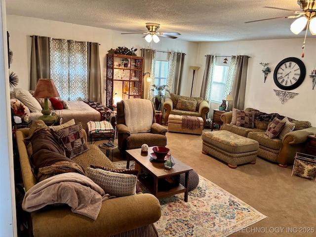 carpeted living area featuring a textured ceiling and a ceiling fan