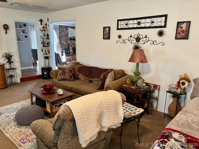 living room with carpet and a brick fireplace