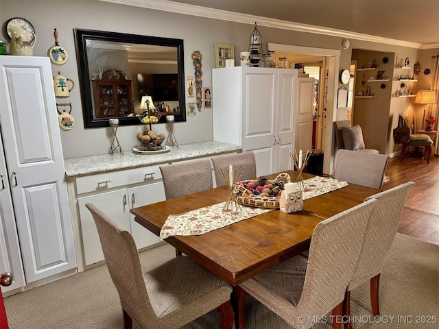 dining room featuring ornamental molding