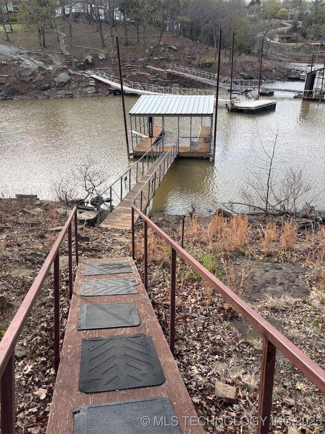 dock area with a water view