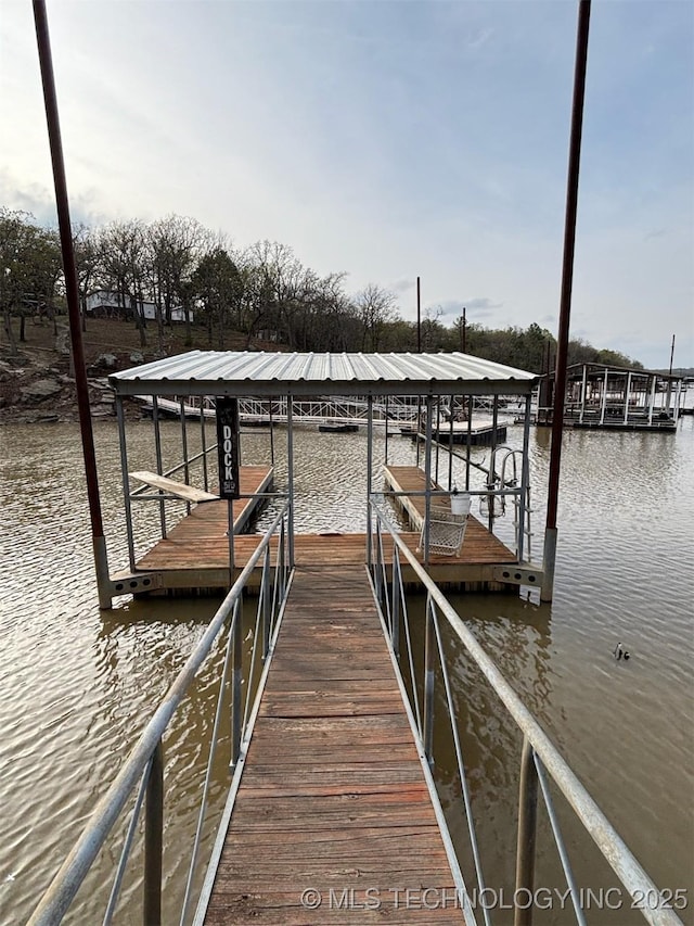 view of dock with a water view