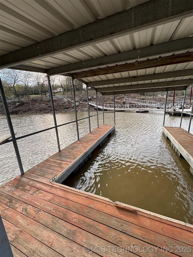view of dock with a water view