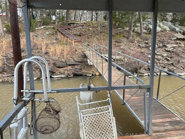dock area with a water view