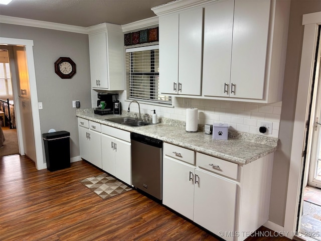 kitchen featuring a sink, dishwasher, dark wood-style floors, decorative backsplash, and ornamental molding