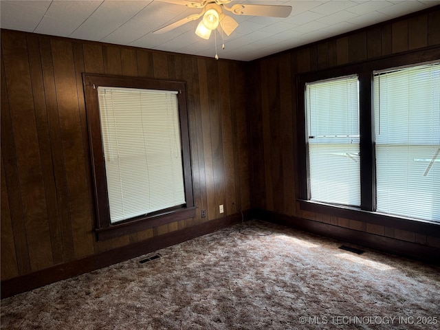 609 N E St, Mcalester, OK 74501 - empty room featuring visible vents, a ceiling fan, and carpet