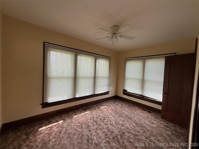 609 N E St, Mcalester, OK 74501 - unfurnished room with ceiling fan, baseboards, visible vents, and carpet floors
