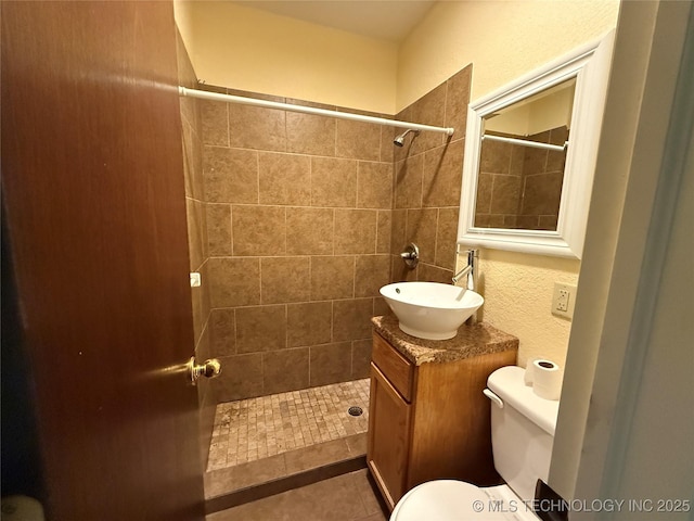 609 N E St, Mcalester, OK 74501 - full bath featuring toilet, tile patterned floors, a tile shower, and vanity