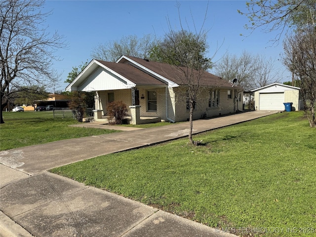 609 N E St, Mcalester, OK 74501 - view of front of property featuring a front yard, brick siding, driveway, and an outdoor structure