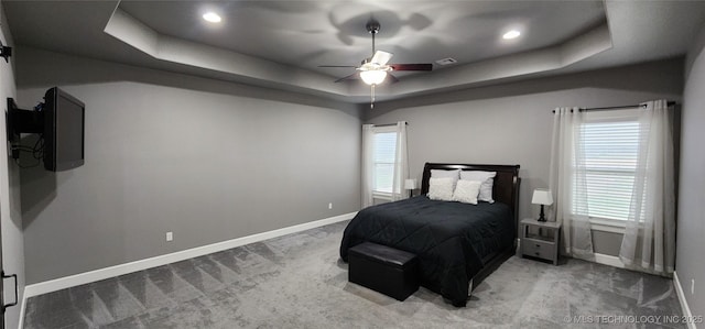 17078 S 11th W Ave, Glenpool, OK 74033 - bedroom featuring light colored carpet, multiple windows, a raised ceiling, and recessed lighting