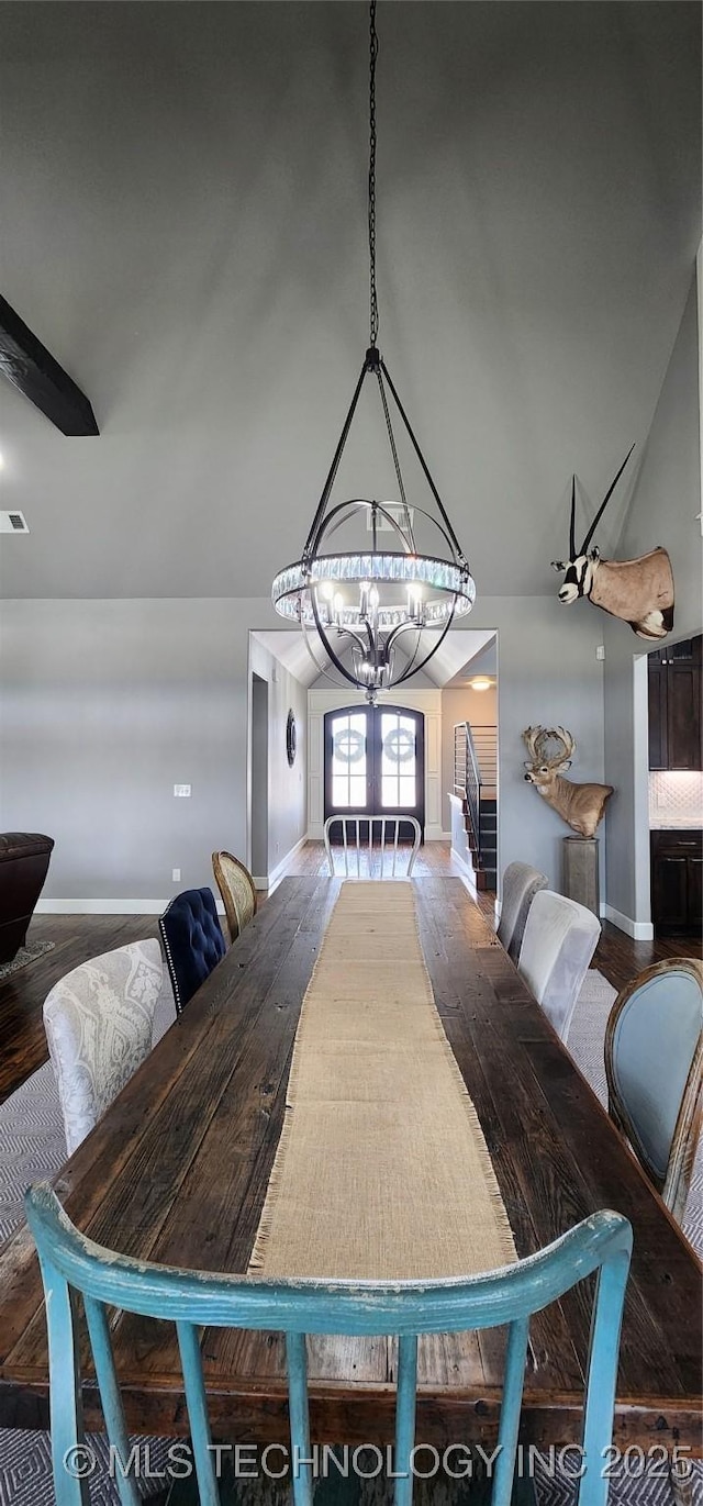 17078 S 11th W Ave, Glenpool, OK 74033 - dining room with wood finished floors, a chandelier, and lofted ceiling