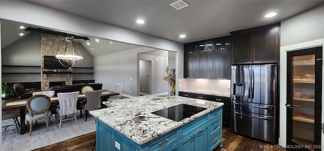 17078 S 11th W Ave, Glenpool, OK 74033 - kitchen with stainless steel fridge with ice dispenser, dark wood-style flooring, black electric cooktop, blue cabinets, and recessed lighting