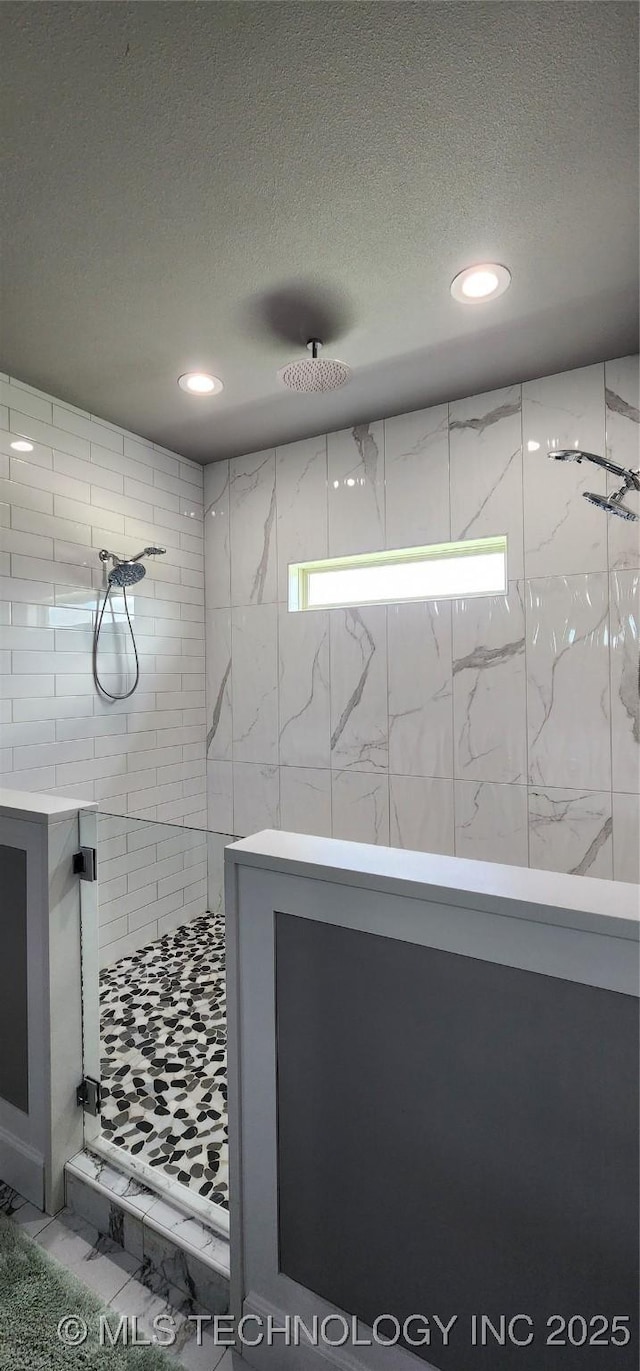 17078 S 11th W Ave, Glenpool, OK 74033 - full bathroom featuring a textured ceiling, a stall shower, and recessed lighting