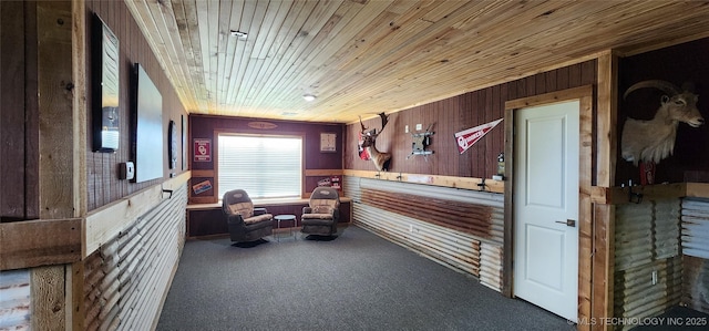 17078 S 11th W Ave, Glenpool, OK 74033 - living area with wood walls, carpet floors, wood ceiling, and a wainscoted wall