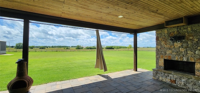17078 S 11th W Ave, Glenpool, OK 74033 - view of patio with an outdoor stone fireplace and a view of rural / pastoral area