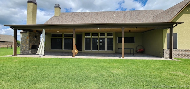 17078 S 11th W Ave, Glenpool, OK 74033 - rear view of property with a patio, a chimney, a lawn, stucco siding, and roof with shingles