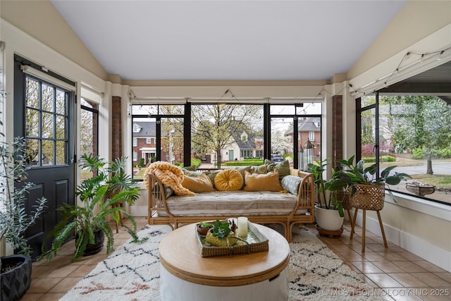 1225 E 18th St, Tulsa, OK 74120 - sunroom / solarium featuring vaulted ceiling, tile patterned flooring, healthy amount of natural light, and outdoor lounge area