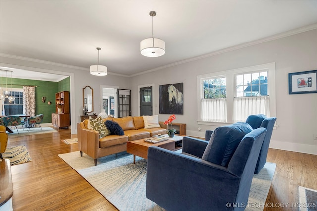 1225 E 18th St, Tulsa, OK 74120 - living room with wood finished floors, ornamental molding, and baseboards
