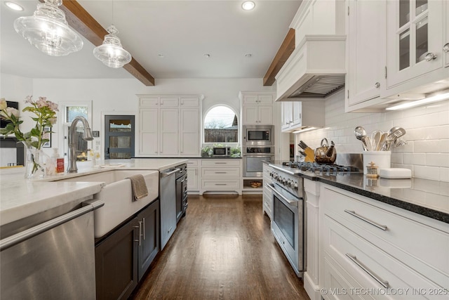 1225 E 18th St, Tulsa, OK 74120 - kitchen with stainless steel appliances, beam ceiling, white cabinets, tasteful backsplash, and premium range hood