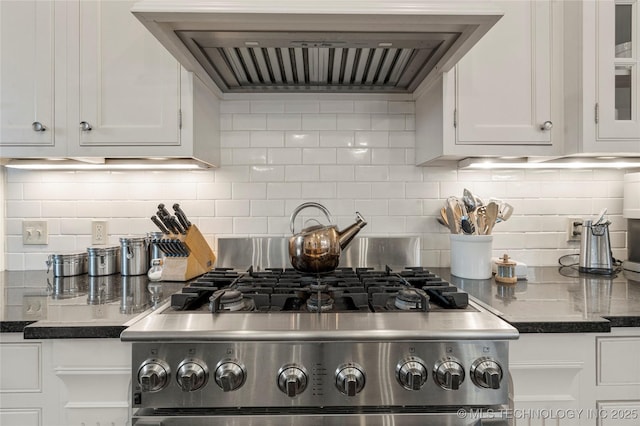 1225 E 18th St, Tulsa, OK 74120 - kitchen with stainless steel range, exhaust hood, white cabinets, backsplash, and glass insert cabinets