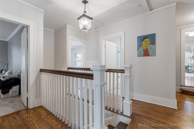 1225 E 18th St, Tulsa, OK 74120 - hall with wood finished floors, an upstairs landing, ornamental molding, baseboards, and a chandelier
