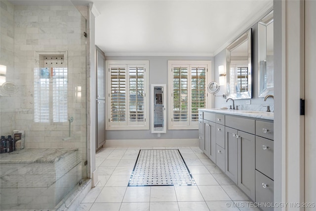 1225 E 18th St, Tulsa, OK 74120 - bathroom featuring crown molding, double vanity, baseboards, a stall shower, and tile patterned flooring