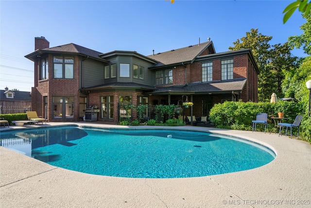 1225 E 18th St, Tulsa, OK 74120 - view of pool featuring a patio and a grill