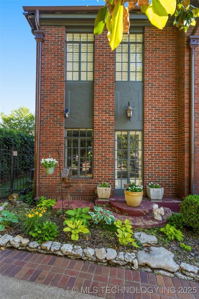 1225 E 18th St, Tulsa, OK 74120 - property entrance featuring brick siding