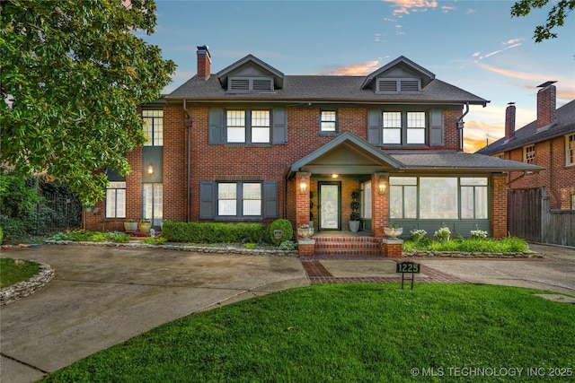 1225 E 18th St, Tulsa, OK 74120 - view of front facade with brick siding and a chimney