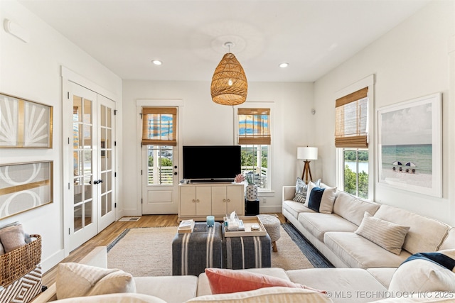 101 Lower Greenway, Carlton Landing, OK 74432 - living room with wood finished floors, french doors, and recessed lighting