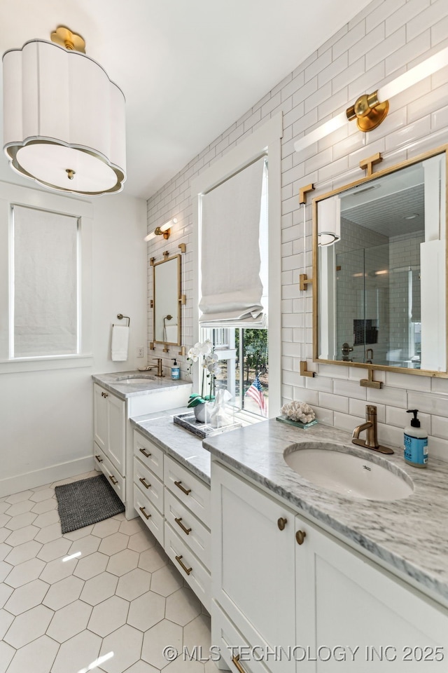 101 Lower Greenway, Carlton Landing, OK 74432 - full bath featuring a sink, two vanities, a shower stall, tasteful backsplash, and tile patterned flooring