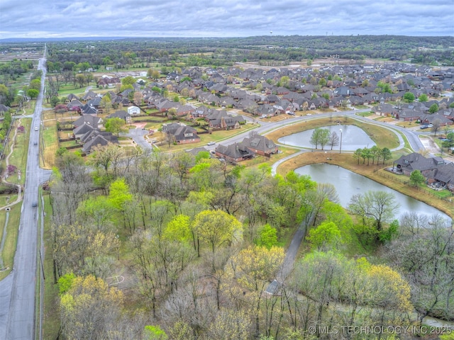 aerial view with a residential view and a water view