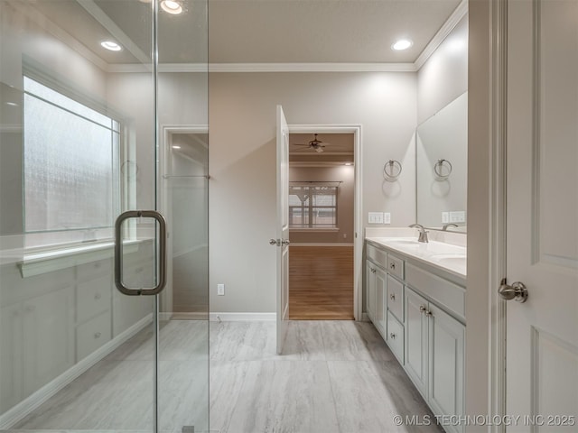 full bathroom featuring double vanity, ornamental molding, ceiling fan, recessed lighting, and a sink