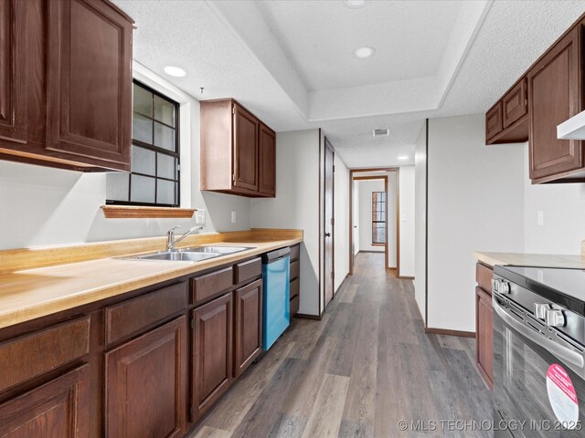 208 NE Spruce Ave, Bartlesville, OK 74006 - kitchen with light countertops, dark wood-style flooring, stainless steel electric range oven, a sink, and dishwasher