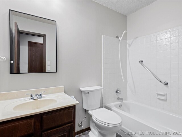 208 NE Spruce Ave, Bartlesville, OK 74006 - bathroom with toilet, vanity, shower / washtub combination, and a textured ceiling