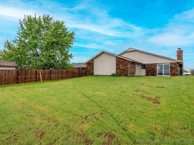 208 NE Spruce Ave, Bartlesville, OK 74006 - exterior space with fence, a storage unit, and an outdoor structure
