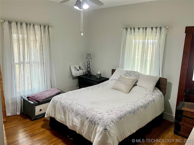 bedroom featuring wood finished floors