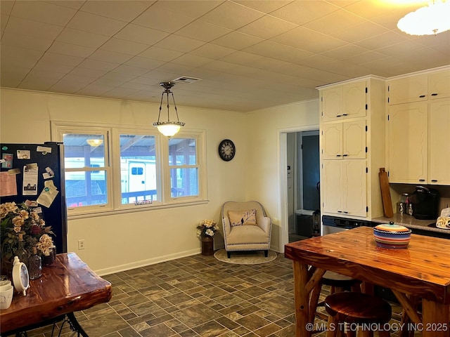 dining room featuring baseboards and visible vents