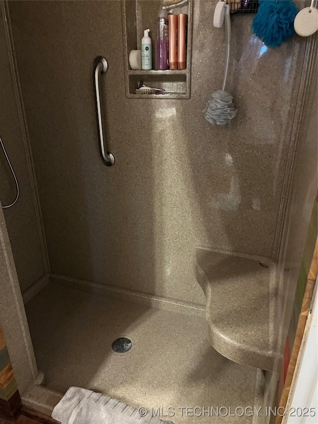 full bath with a shower stall