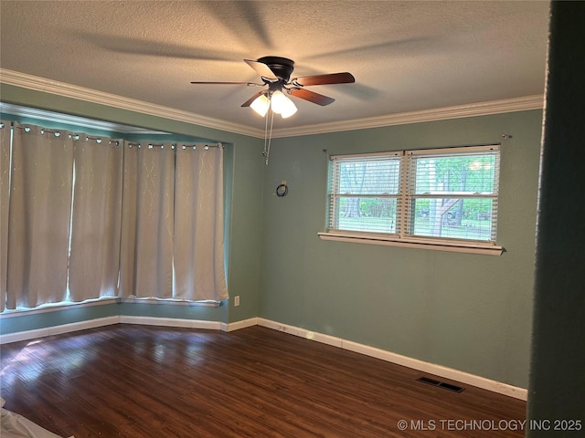 unfurnished room featuring a ceiling fan, wood finished floors, a textured ceiling, baseboards, and visible vents