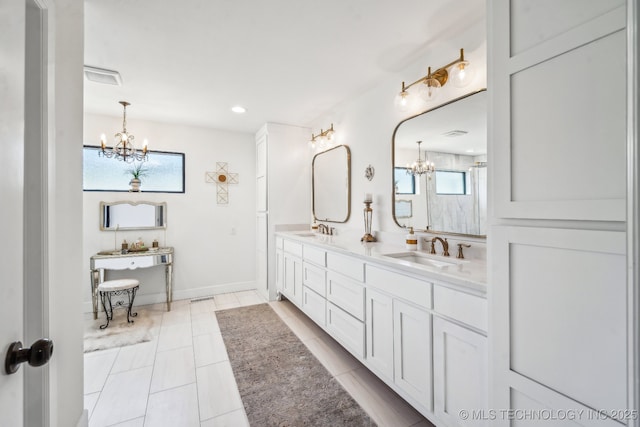12255 Avalon Dr, Sperry, OK 74073 - bathroom with a chandelier, double vanity, and recessed lighting