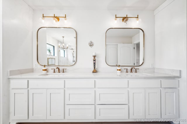 12255 Avalon Dr, Sperry, OK 74073 - full bath with double vanity and a chandelier
