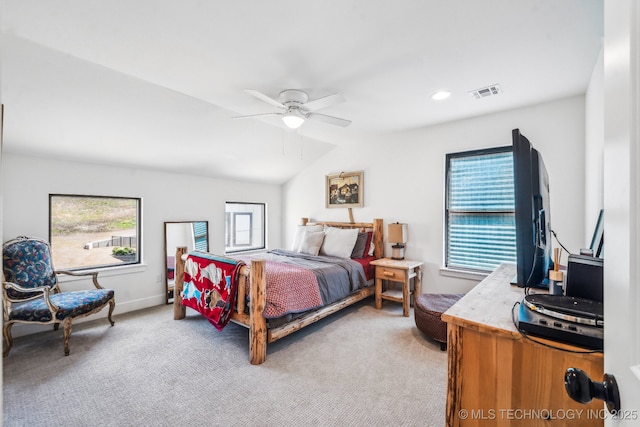 12255 Avalon Dr, Sperry, OK 74073 - bedroom with multiple windows, light carpet, vaulted ceiling, and ceiling fan