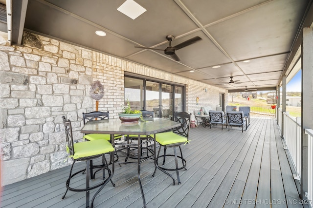 12255 Avalon Dr, Sperry, OK 74073 - wooden terrace with outdoor dining area and ceiling fan