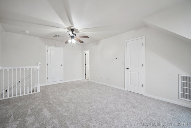 additional living space with visible vents, ceiling fan, carpet flooring, and baseboards