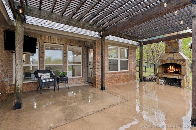 view of patio featuring a pergola and an outdoor stone fireplace