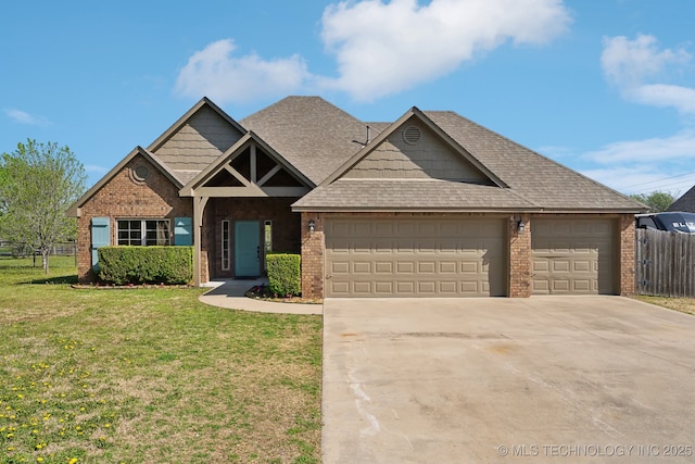 craftsman-style home featuring concrete driveway, a front lawn, brick siding, a garage, and fence