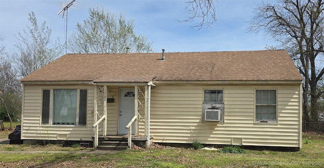 bungalow-style home featuring a shingled roof