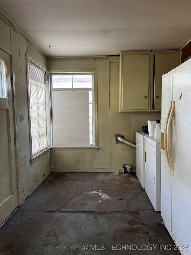 1562 S Hickory Ave, Bartlesville, OK 74003 - kitchen with washer and dryer, white fridge with ice dispenser, healthy amount of natural light, and unfinished concrete flooring
