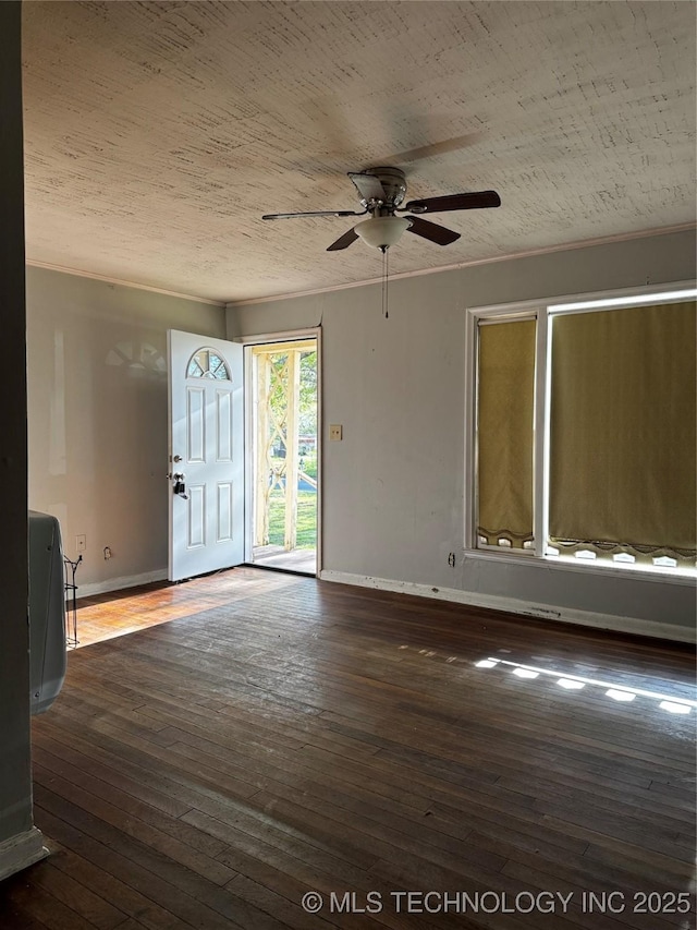 1562 S Hickory Ave, Bartlesville, OK 74003 - empty room featuring ceiling fan, hardwood / wood-style flooring, and baseboards