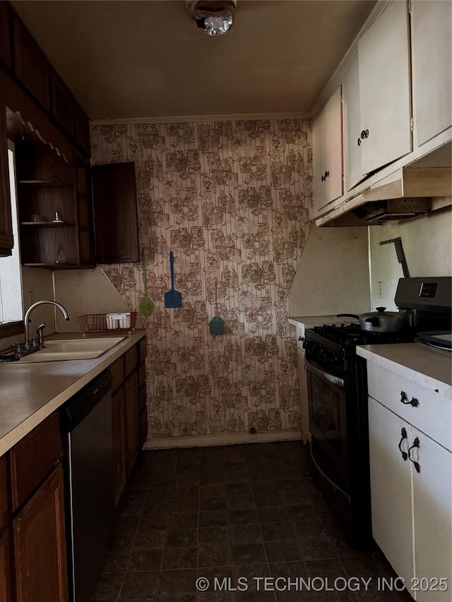 1562 S Hickory Ave, Bartlesville, OK 74003 - kitchen with black range with gas stovetop, a sink, dishwasher, baseboards, and wallpapered walls